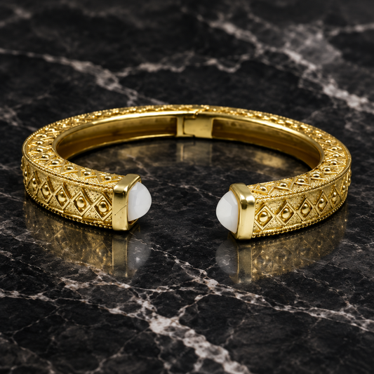 Matte gold ornate open bangle bracelet by Bobk with intricate detailing and elegant design.