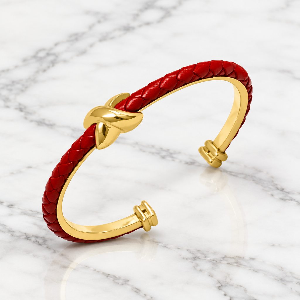 Leather braided X bangle bracelet by Bobk, featuring a stylish woven design and metallic accents.