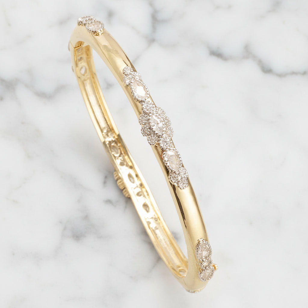 Gold Fancy CZ Flower Bangle bracelet by Lorena, featuring intricate flower design with sparkling cubic zirconia stones.