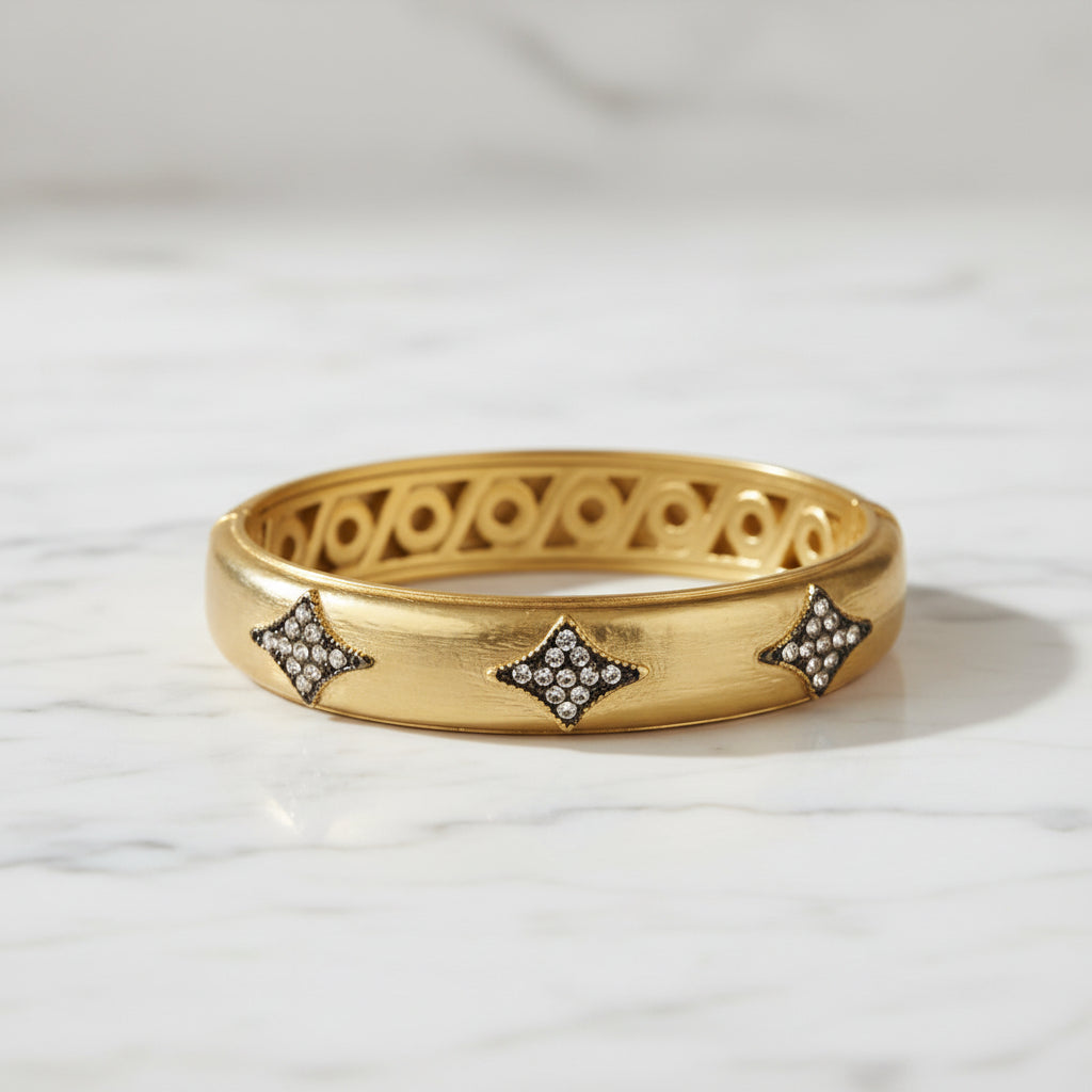 Lorena gold and hem diamond bracelet showcasing a elegant design with sparkling diamonds and gold accents.