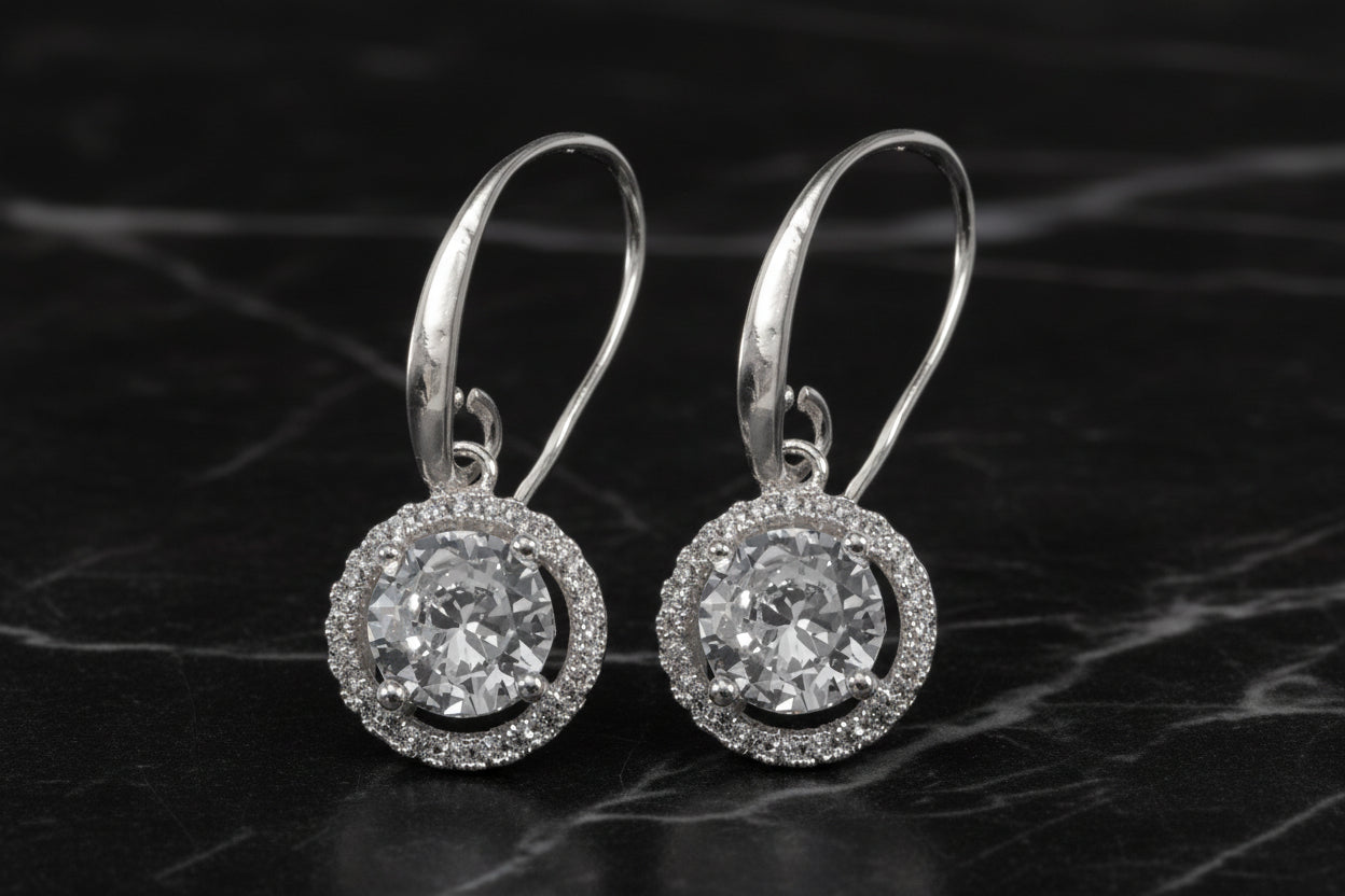 Lorena fancy silver round CZ earring with sparkling cubic zirconia, showcasing a sleek, elegant jewelry design.