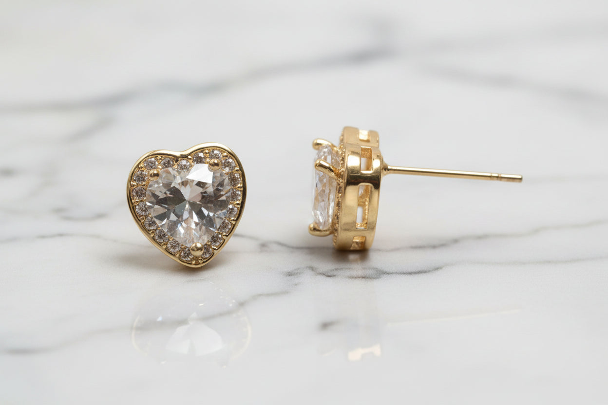 Lorena gold CZ heart stud earring with sparkling cubic zirconia, showcasing a delicate and elegant jewelry design.
