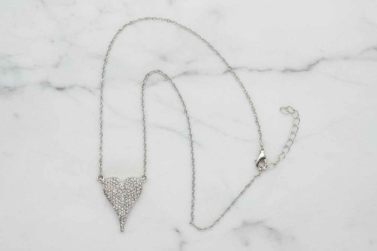 Lorena pave heart necklace with 16-inch chain showcasing a sparkling heart pendant on a delicate chain.