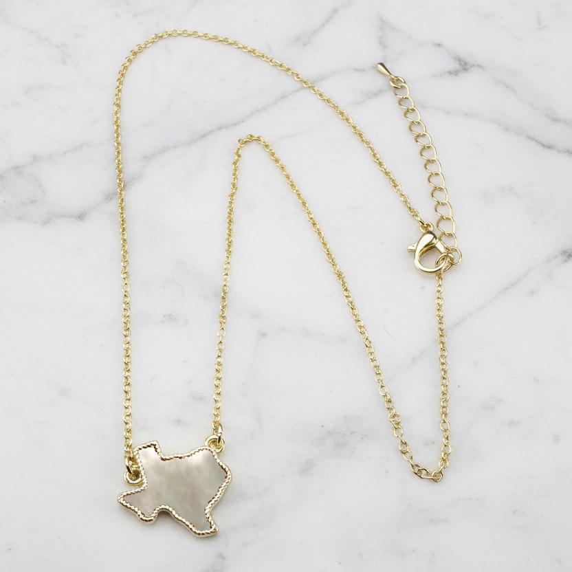 Gold Texas necklace by Lorena, 16-inch chain with detailed Texas-shaped pendant, shiny and stylish jewelry accessory.