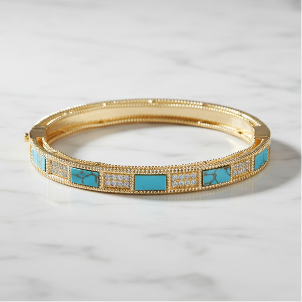 Gold MX bracelet with pave and stone accents featuring a stylish, elegant design perfect for accessorizing.