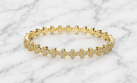 Silver 4-CZ Clover Bangle bracelet by Joseph Anthony Inc. featuring four cubic zirconia clover charms on a sleek silver band.