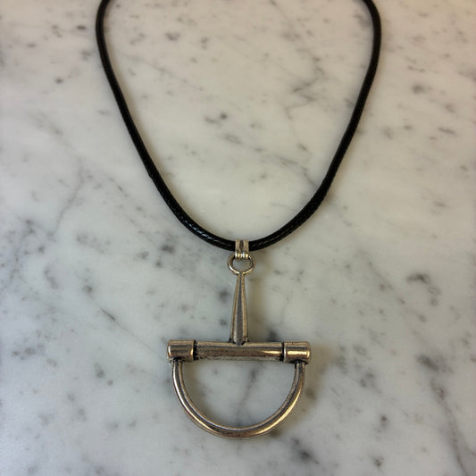 Black cord necklace with a burnished horsebit detail from Water & Tree, stylish jewelry accessory.