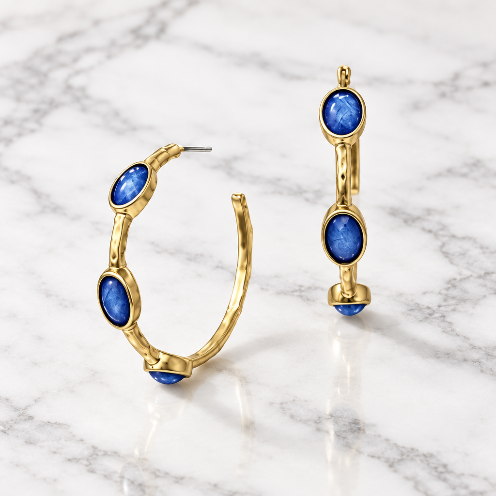 Bobk bamboo hoop earrings with embedded stones, showcasing sleek gold-colored hoops with sparkling accents.