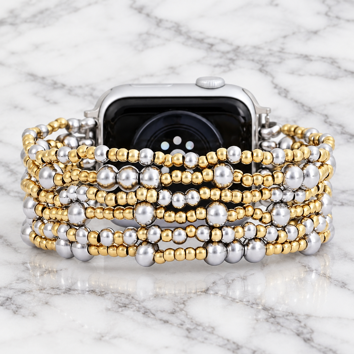 Luxurious gold and silver beaded Demure stretch Apple Watch band by Cape Diablo, designed for a stylish and comfortable fit.