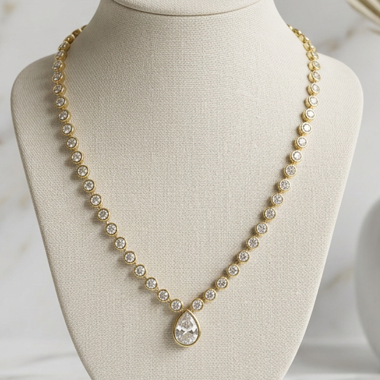 Joseph Anthony Inc. All Around CZ Pear Drop Necklace featuring sparkling cubic zirconia and a delicate chain.