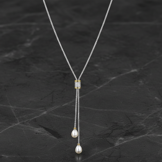 Two-tone CZ and pearl lariat necklace by Joseph Anthony Inc., featuring shimmering cubic zirconia and elegant pearl accents.