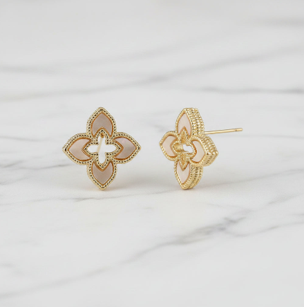 Lorena gold cuff earrings featuring a clover design, showcasing elegant jewelry with a shiny gold finish.