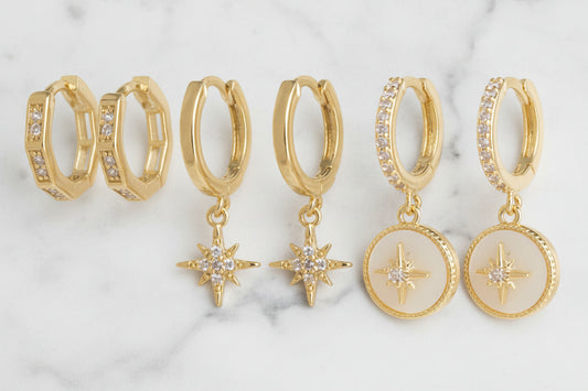 Three-piece gold huggie earring set by DX Collection, LLC, featuring small, stylish hoop earrings for everyday wear.