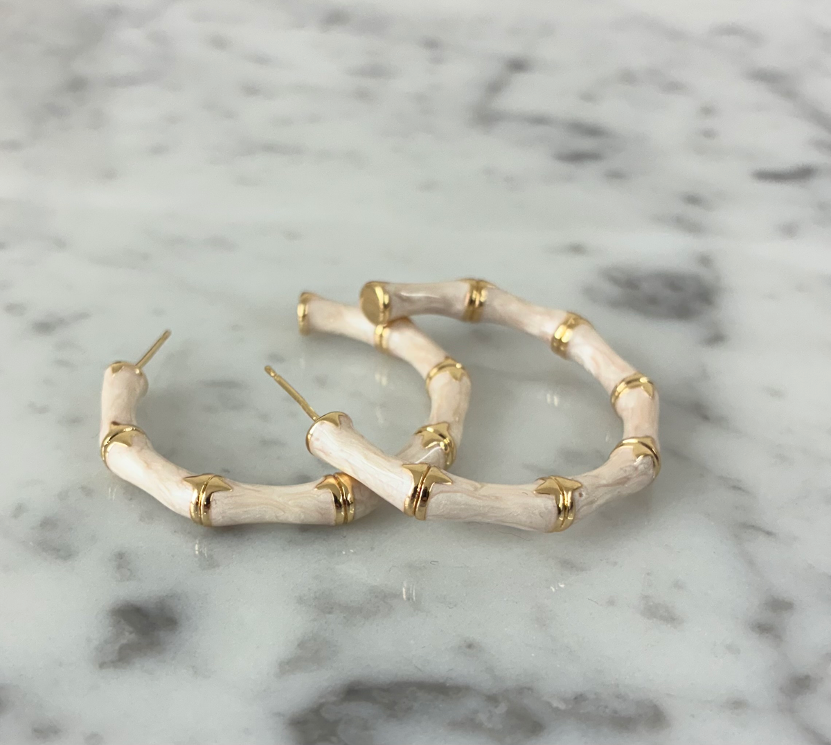 Gold bamboo half hoop earrings by DX Collection, LLC featuring a stylish half hoop design with a smooth bamboo-inspired texture.