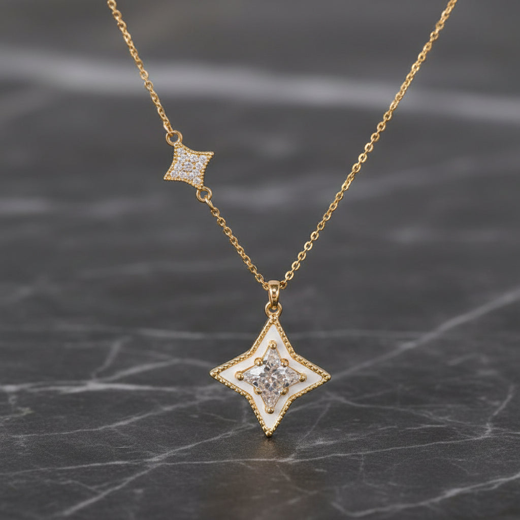 Gold CZ 4-point star necklace from DX Collection, LLC, featuring a 16-inch chain and star pendant with sparkling cubic zirconia.