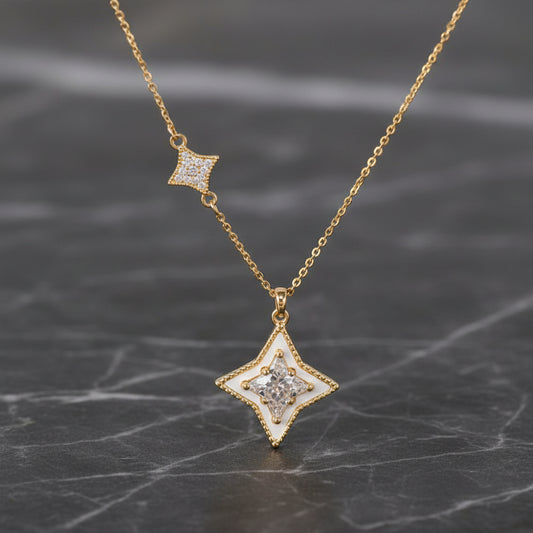 Gold CZ 4-point star necklace from DX Collection, LLC, featuring a 16-inch chain and star pendant with sparkling cubic zirconia.