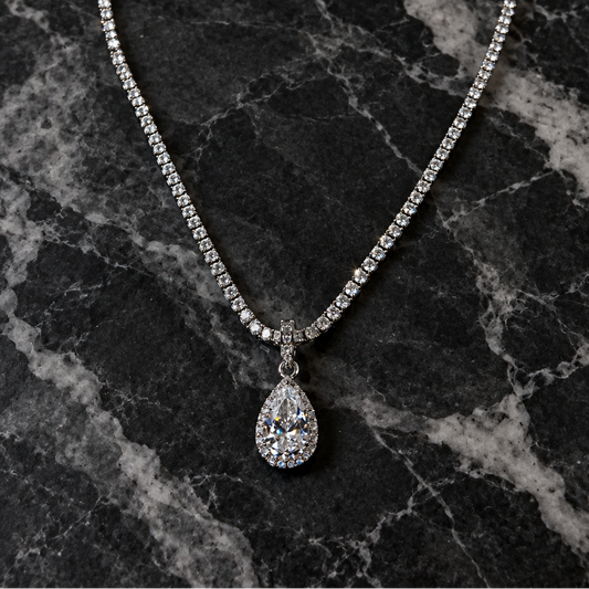 MILAA Teardrop CZ dangle necklace featuring sparkling clear cubic zirconia stones on a delicate chain.