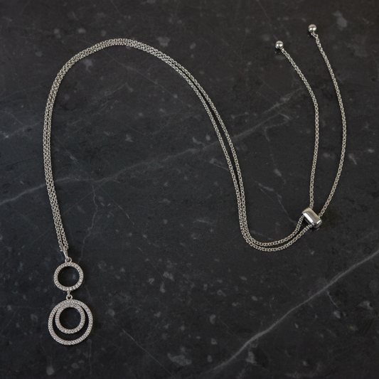 Joseph Anthony Inc. CZ Circles Slide Lock Necklace featuring a silver chain with circular CZ pendant, elegant and stylish jewelry piece.