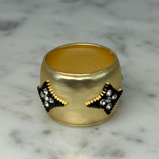 Wide gold band ring with hem design by MX, featuring a sleek, modern style and smooth, polished finish.