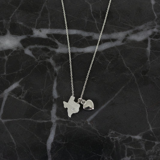 Small State of Texas necklace with heart charm, Lauren-Spencer jewelry featuring a delicate metal pendant on a chain.