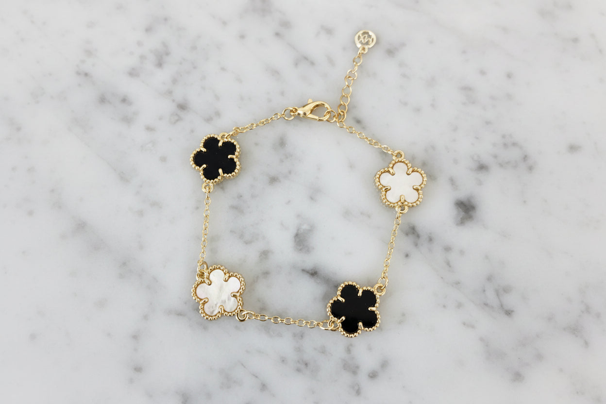 Lorena Gold 4-Clover Chain Bracelet featuring a delicate gold chain with four-leaf clover charms, stylish jewelry accessory.