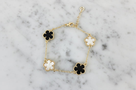 Lorena Gold 4-Clover Chain Bracelet featuring a delicate gold chain with four-leaf clover charms, stylish jewelry accessory.