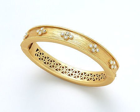 Brushed gold and CZ bracelet by Lorena featuring sparkling cubic zirconia accents on a sleek jewelry design.