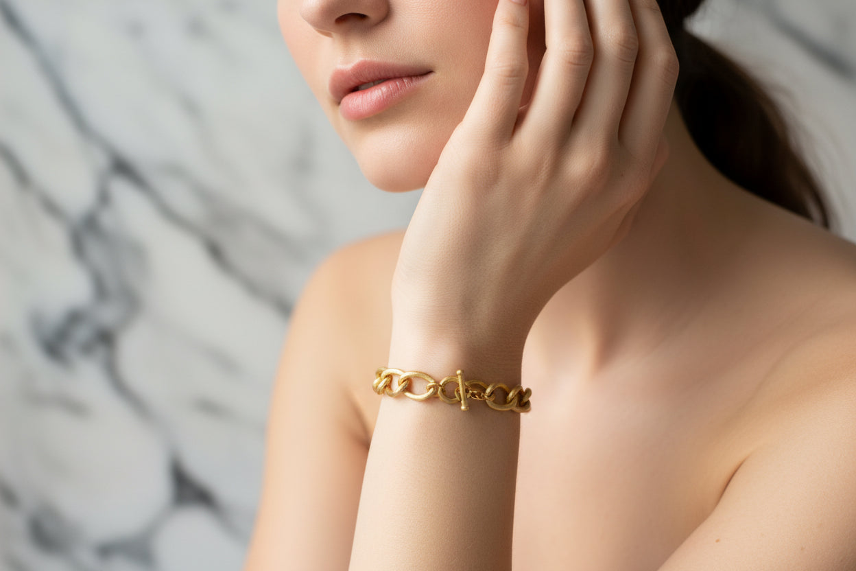 Lorena brushed gold link bracelet with sleek, interconnected chain design on a neutral background.