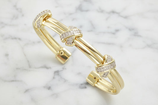 Lorena Gold 3-Pave X Cuff Bracelet with sparkling pave accents and sleek design, showcasing its elegant gold finish.