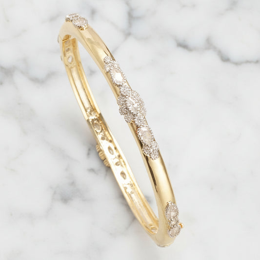 Gold Fancy CZ Flower Bangle bracelet by Lorena, featuring intricate flower design with sparkling cubic zirconia stones.
