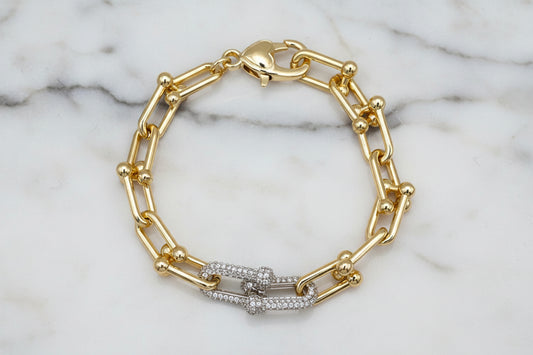 Gold Lorena link bracelet featuring pave link front with intricate detailing and a polished finish.