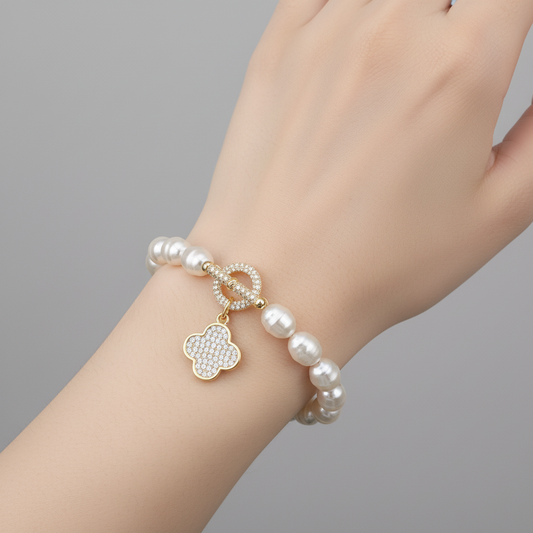 Lorena pearl bracelet with pave toggle clasp and charm accents, elegant jewelry accessory featuring lustrous pearls and detailed design.