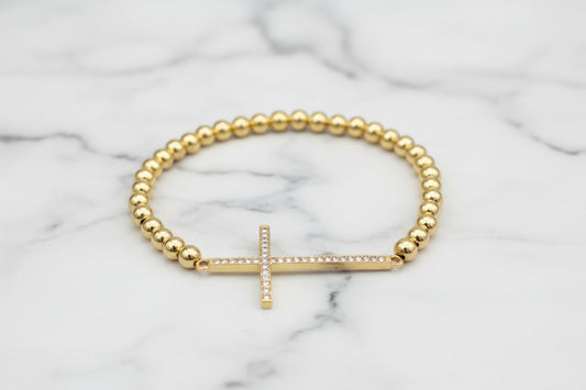 Lorena bead bracelet with a long CZ cross pendant, featuring sparkling cubic zirconia stones and a stylish design.