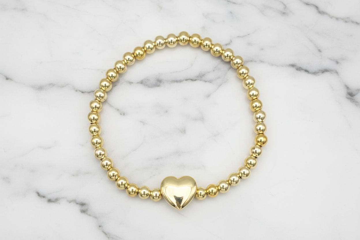 Lorena beady stretch bracelet with heart charm, featuring colorful beads and elastic band for a comfortable fit.