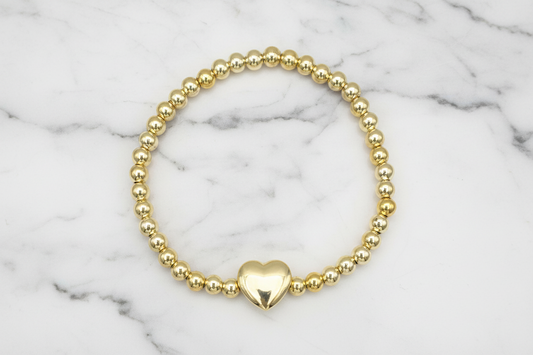 Lorena beady stretch bracelet with heart charm, featuring colorful beads and elastic band for a comfortable fit.