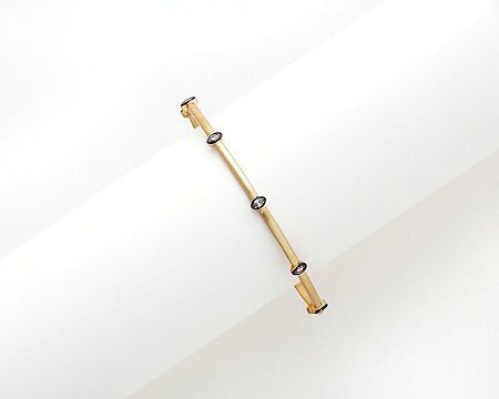 Lorena gold hem CZ marquis bangle bracelet with sparkling cubic zirconia accents and elegant design.