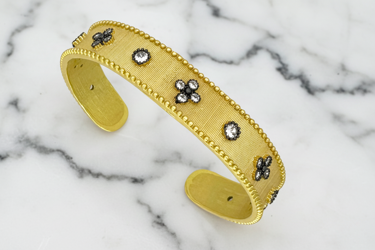 Lorena brushed cuff bracelet with intricate design, featuring a stylish metal band for a modern accessory look.