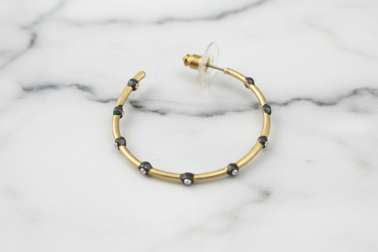 Lorena 1.5-inch matte gold and hematite CZ hoop earring, stylish jewelry with sparkling cubic zirconia accents.