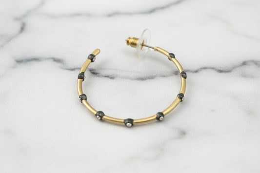 Lorena 1.5-inch matte gold and hematite CZ hoop earring, stylish jewelry with sparkling cubic zirconia accents.