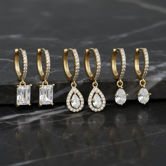 Lorena 3-piece dangle CZ earrings set featuring sparkling cubic zirconia designs on silver-tone earrings.