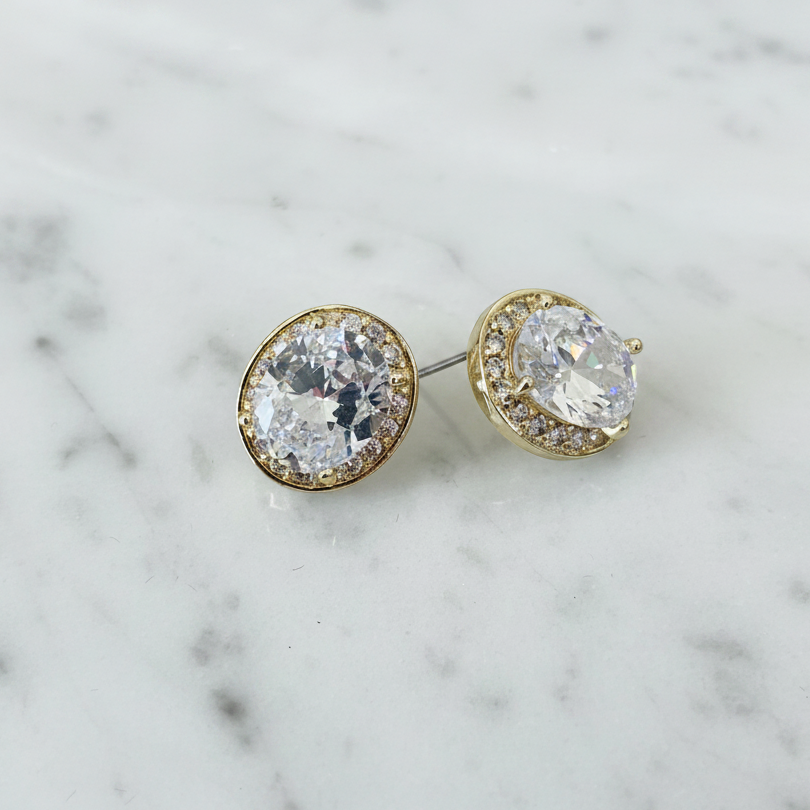 Lorena Brilliant Oval CZ and Gold Earring with a polished gold finish and sparkling oval cubic zirconia centerpiece.