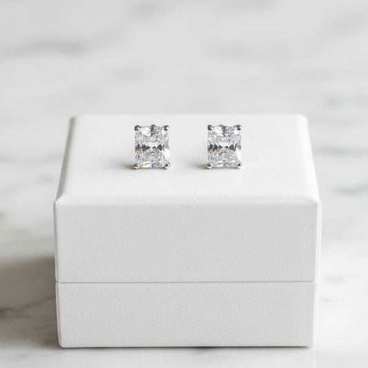 Lorena emerald cut stud earrings with sparkling cubic zirconia stones on a sleek metal setting.