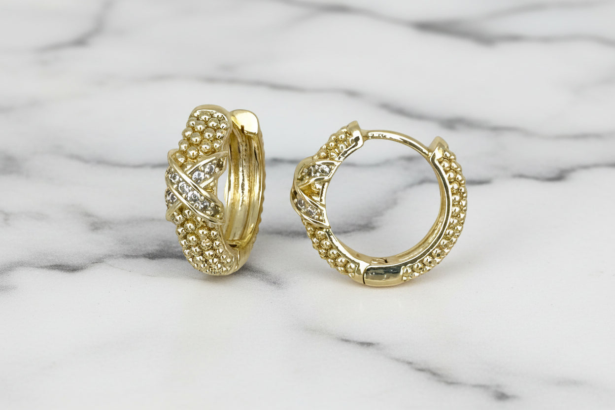 Lorena gold bead huggie earring with pave X design, featuring small gold beads and sparkling pavé accents.
