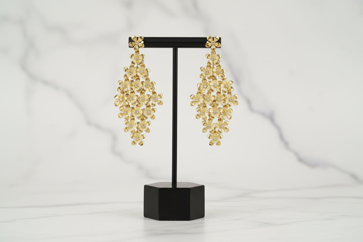 Lorena gold flower earrings featuring intricate petal designs, elegant jewelry perfect for special occasions.