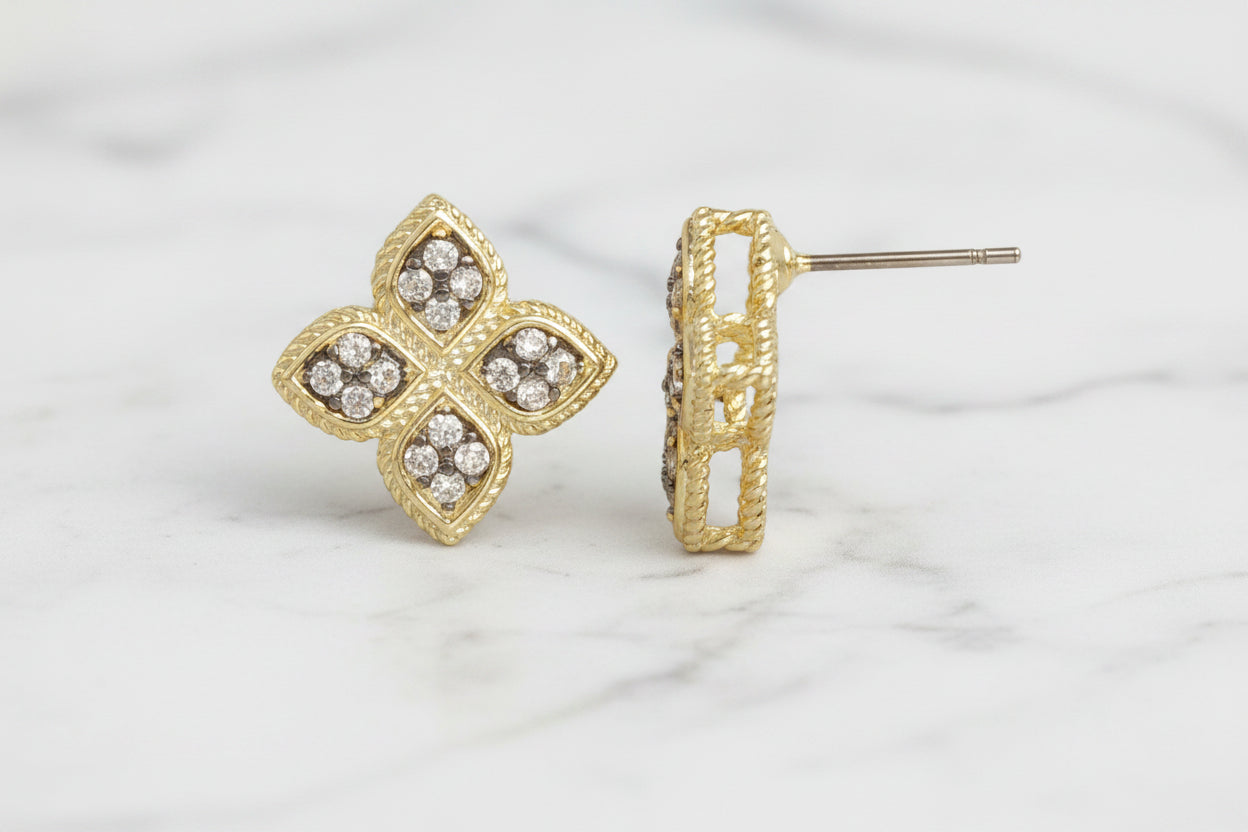 Lorena gold and hematite clover post earring featuring a polished gold finish and hematite accents, designed for pierced ears.