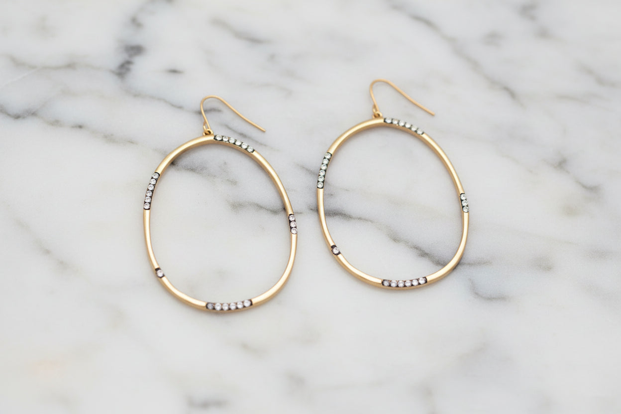 Lorena gold hematite CZ large oval dangle earring showcasing shiny hematite stones and elegant gold-toned metal.
