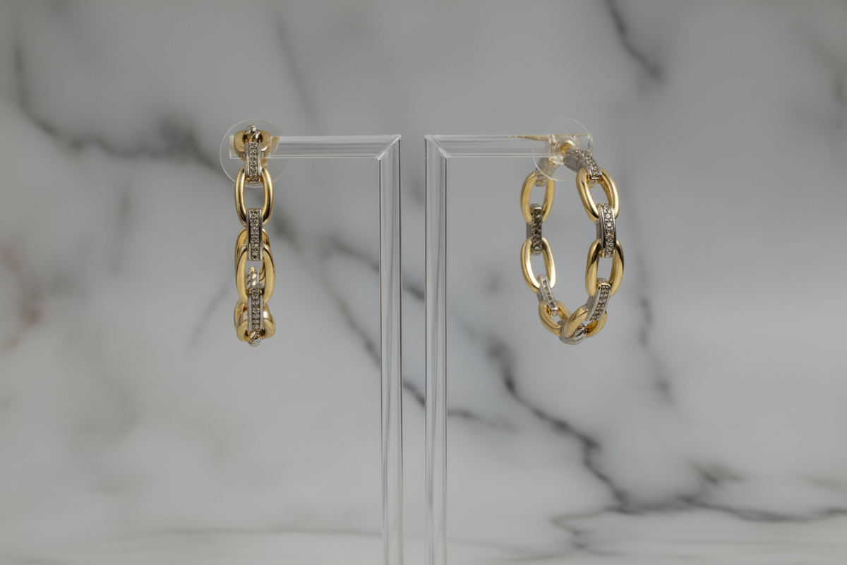 Lorena two-tone chain link hoop earring with bold, interconnected design, made of mixed metal tones for a stylish look.