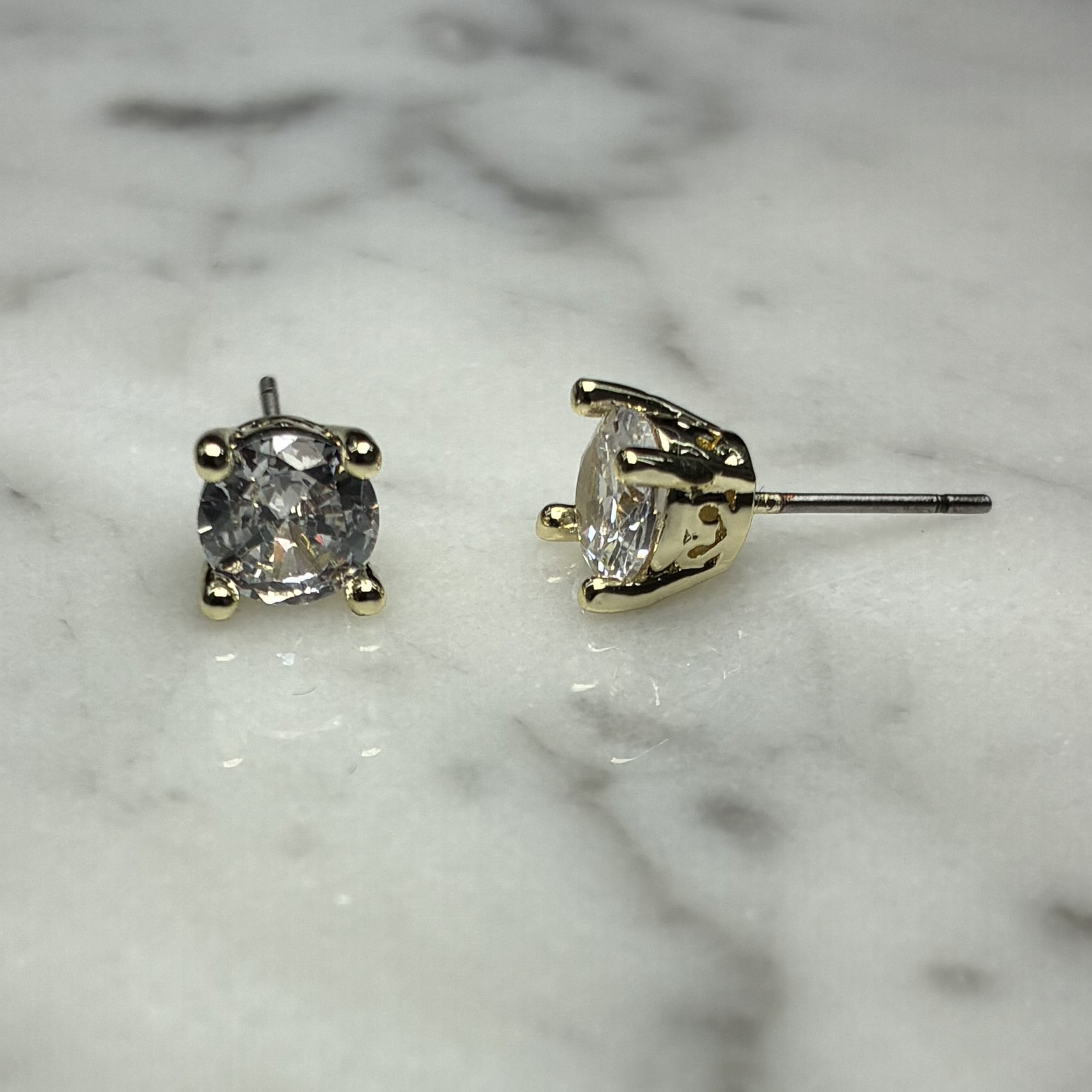 Lorena 6mm cubic zirconia stud earring with a silver-tone setting, showcasing a sparkling gemstone on a classic post.