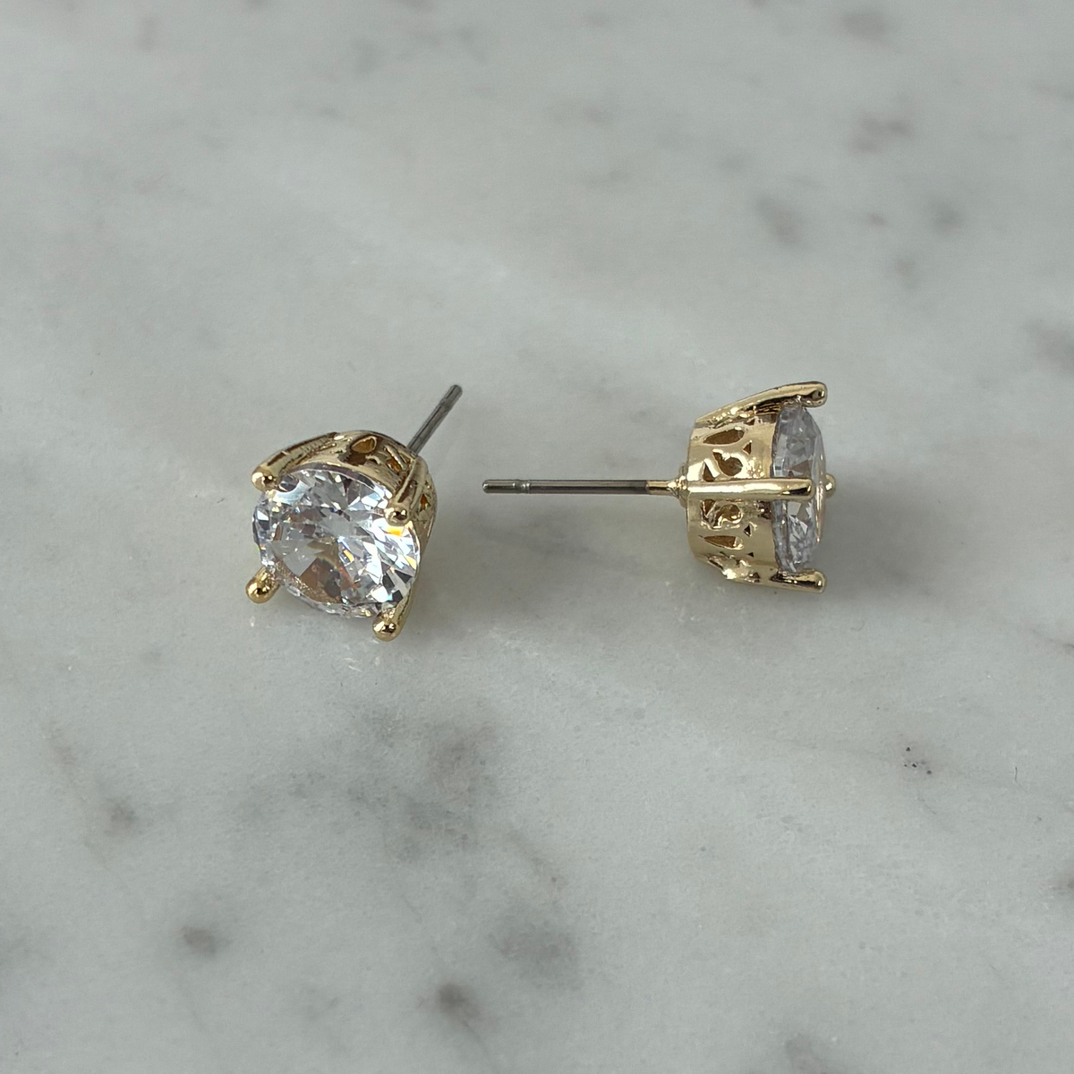 Lorena 8mm cubic zirconia stud earring with sparkling clear gemstone in a silver-tone setting, showcasing elegant jewelry design.