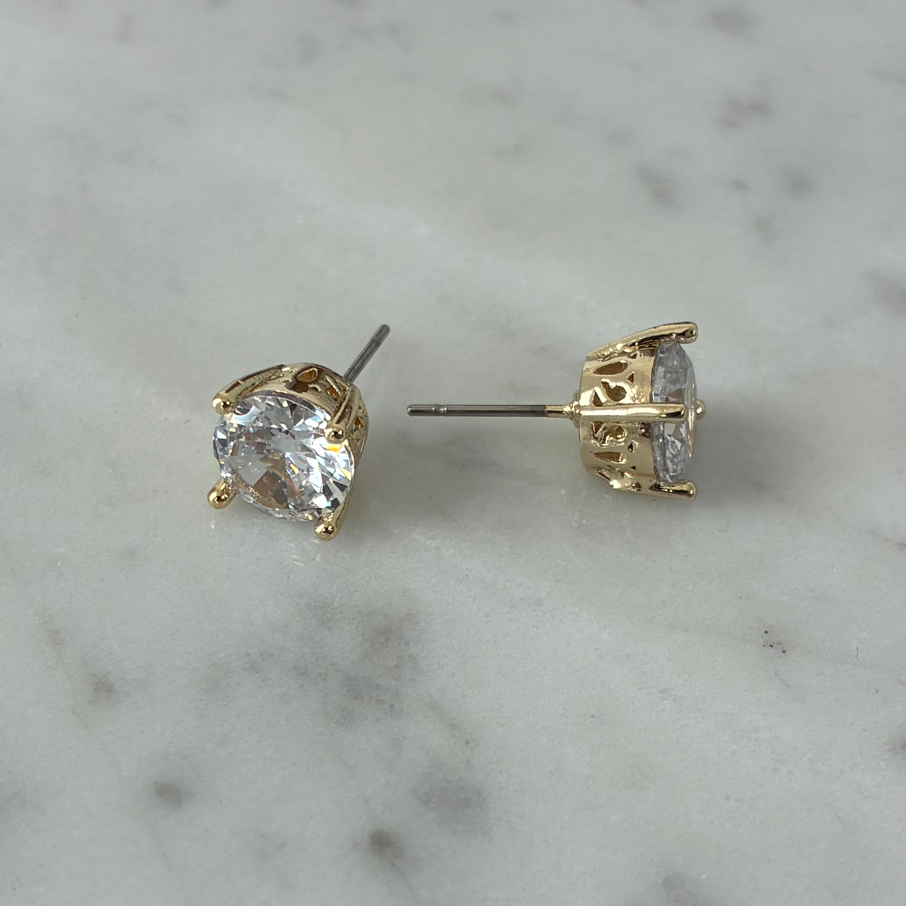 Lorena 8mm cubic zirconia stud earring with sparkling clear gemstone in a silver-tone setting, showcasing elegant jewelry design.